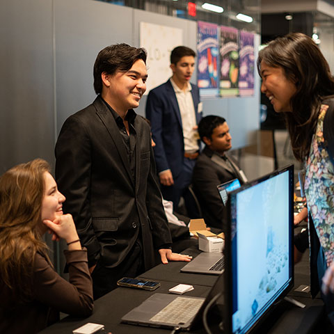 Students interacting at Incubator Showcase