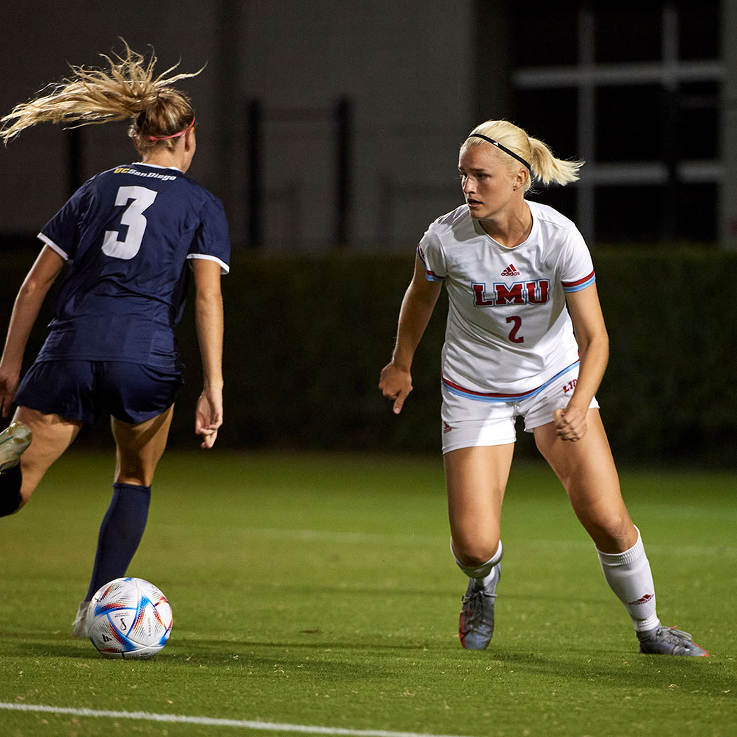 Alice Santen defending against soccer player with ball