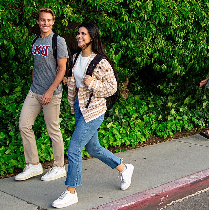 two students walking on campus